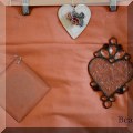 D47. 3-Piece lot. Two sun catchers and a ceramic hanging heart. - $20 for the set 